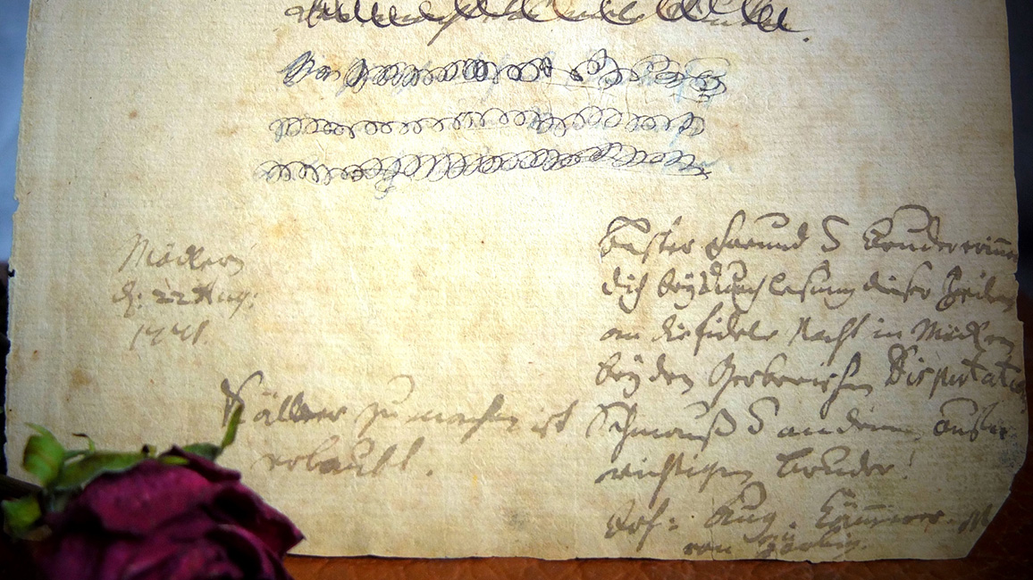 ausgerissene Buchseite mit handschriftlicher Nachricht von Johann August K&auml;mmerer 